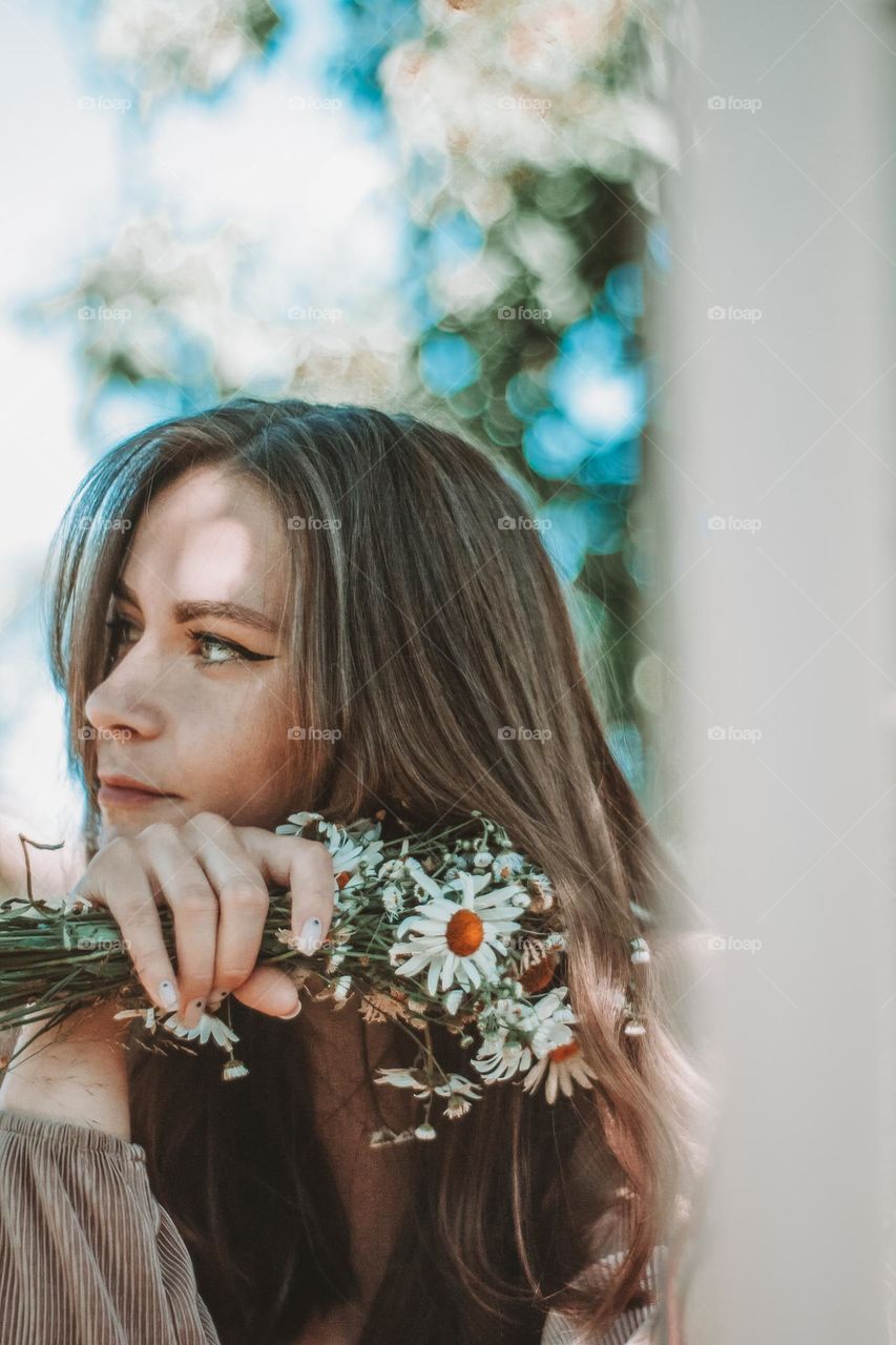 photo of a woman with her handpicked summer flowers