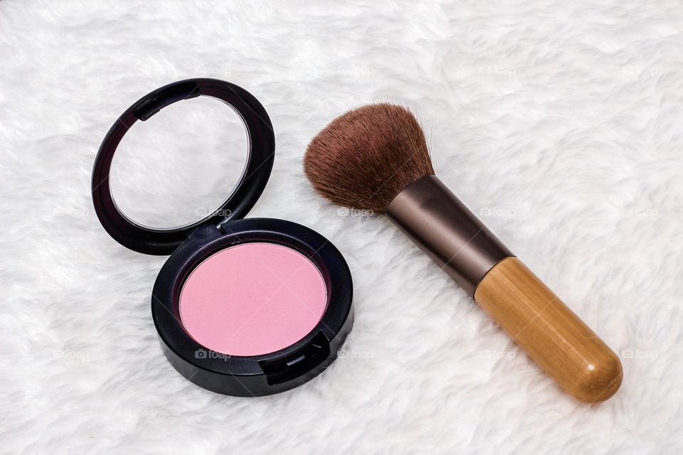 Pink blush and powder brush 