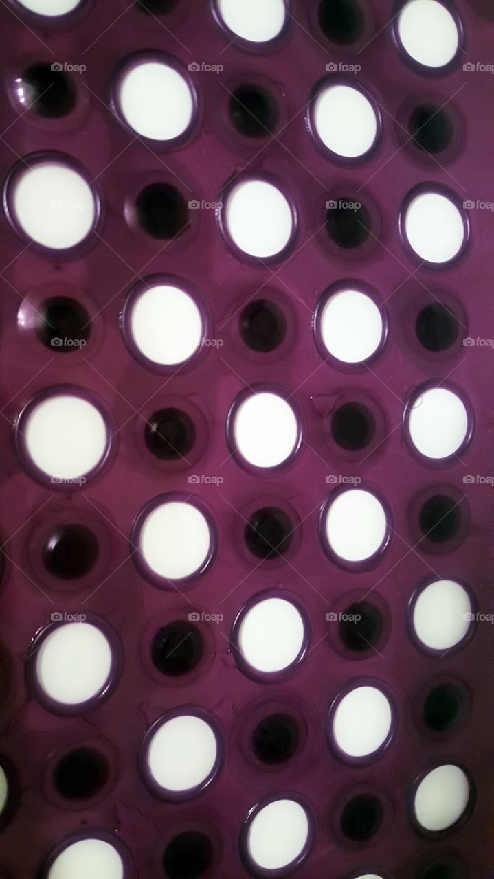 Purple rubber mat in the shower....