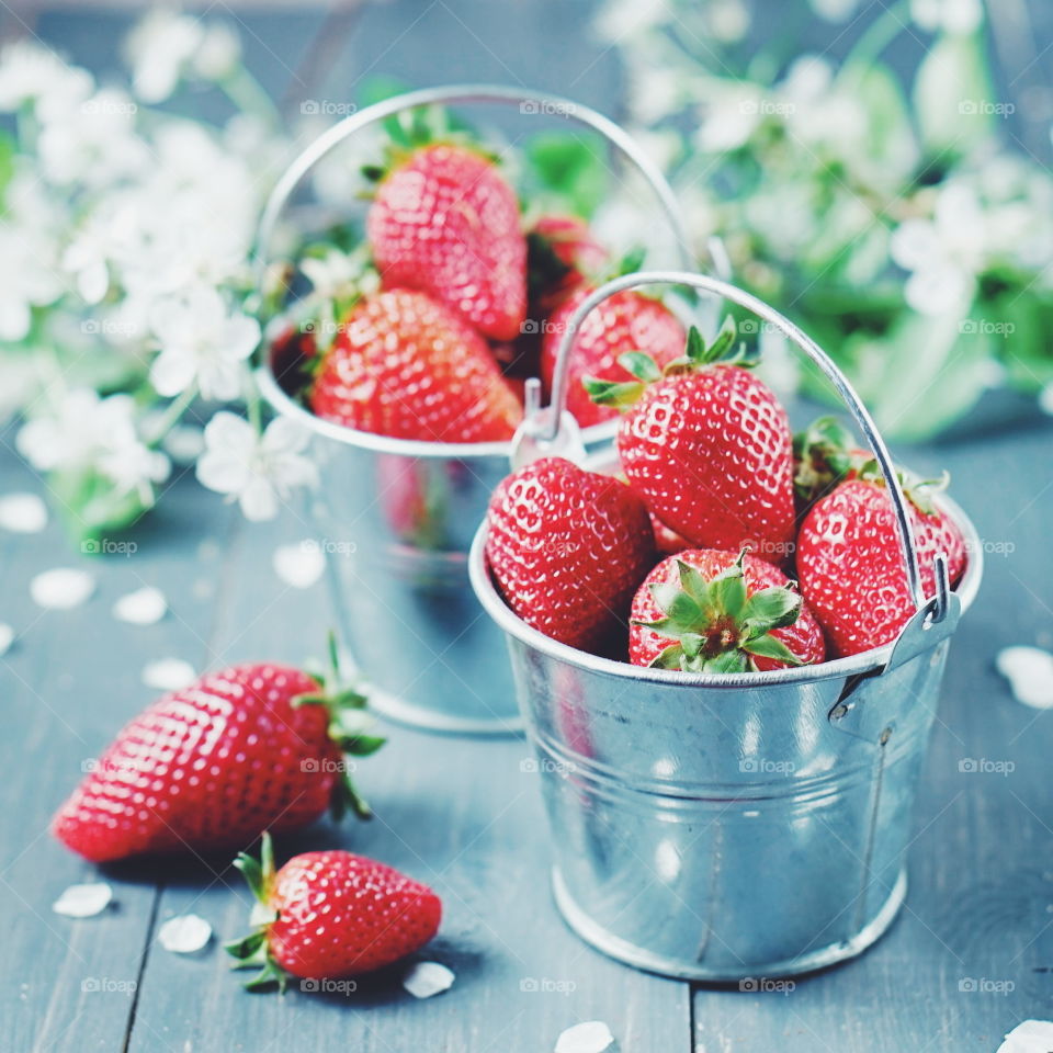 Close-up of red strawberries in bucket