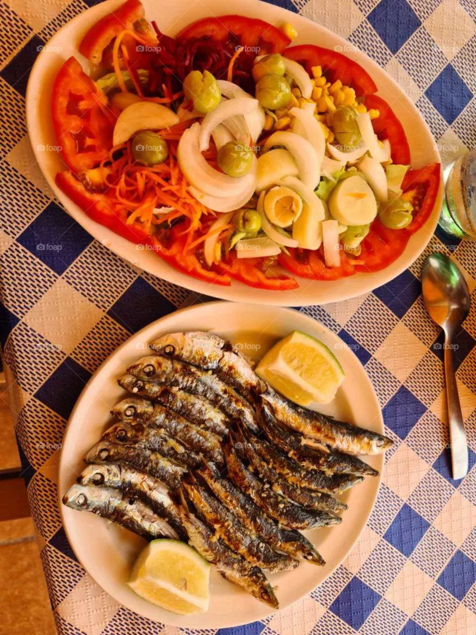 Grilled sardines with lemon and vegetables. Healthy meal. Stay fit.