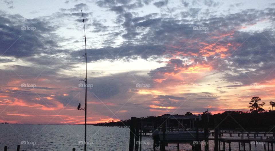 Fishing pole at sunset . Sunset fishing 