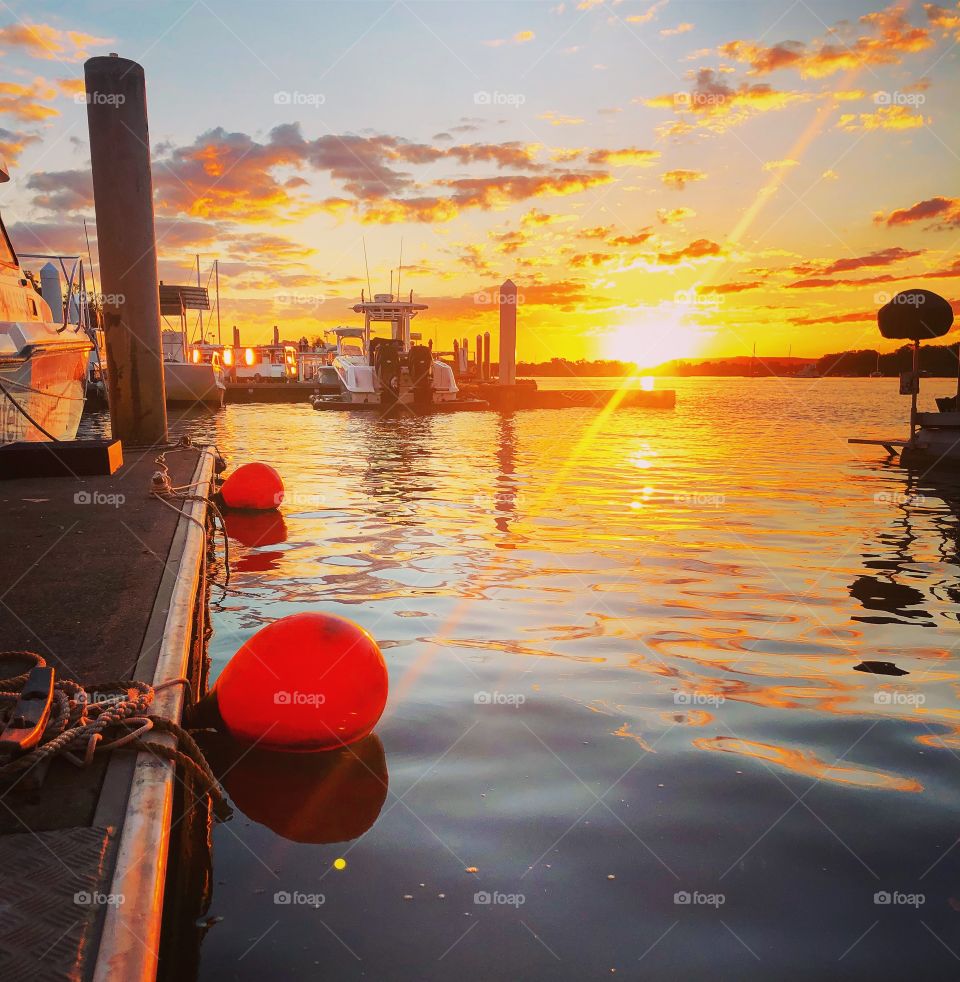 Bouys and boats at sunset 