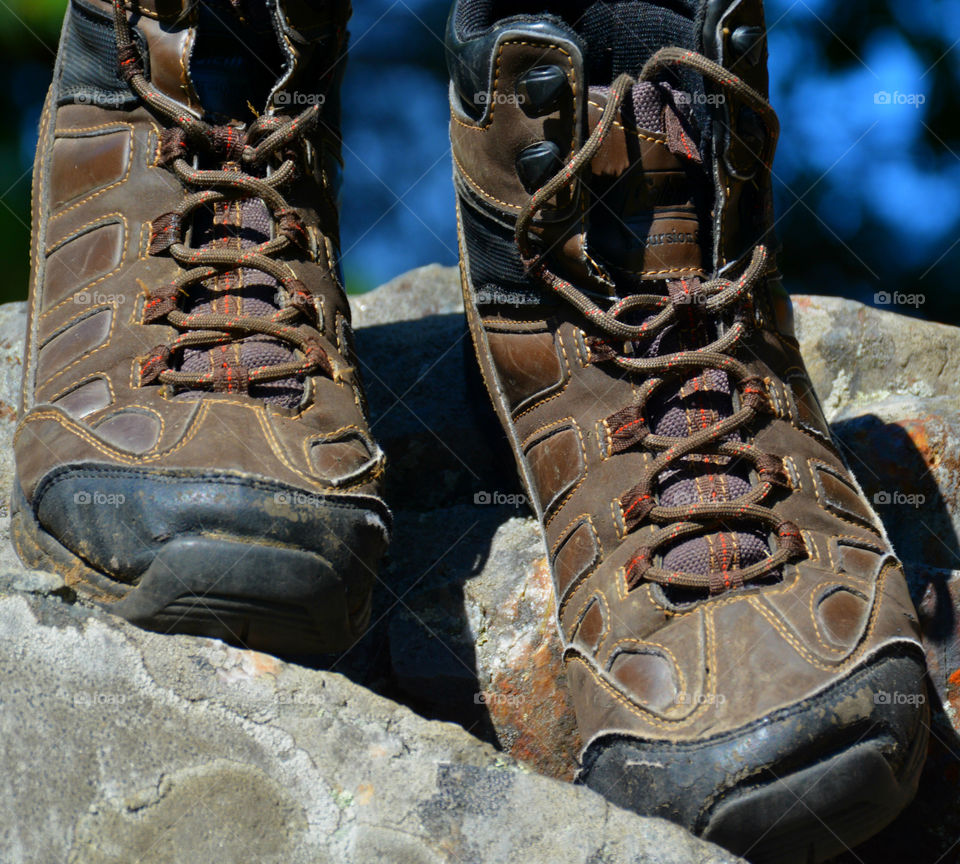 The boots were old. The leather had since cracked and aged. The toes were scuffed and they were falling apart at the seams. The boots had long lived their life of travel,work,joy, and love. After their final journey, it was time to throw them away. It was hard to say GOODBYE!