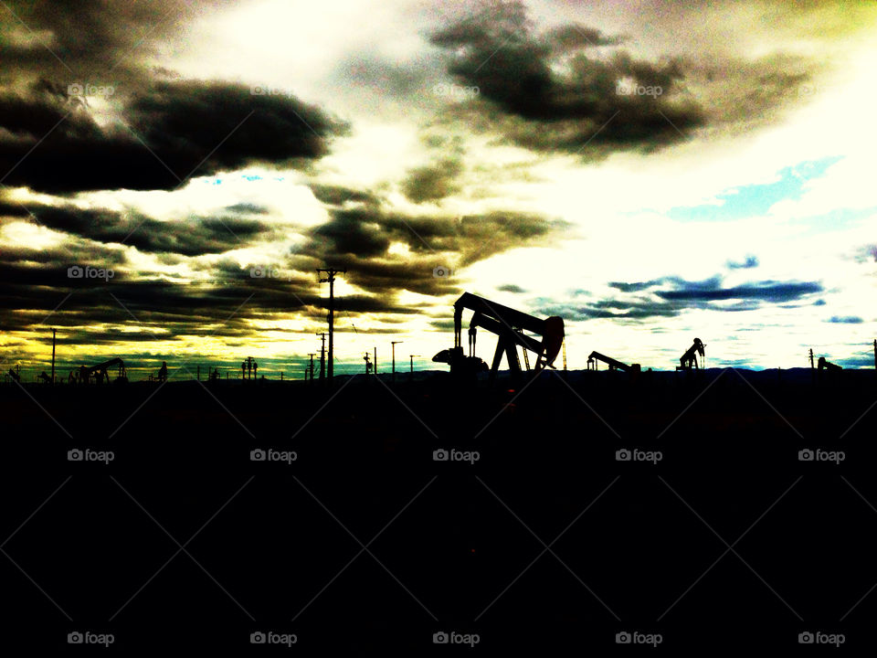 Nodding donkey oil derricks in a California oil field