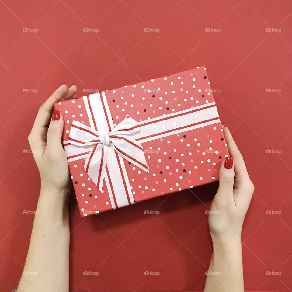 Woman hands holding a gift