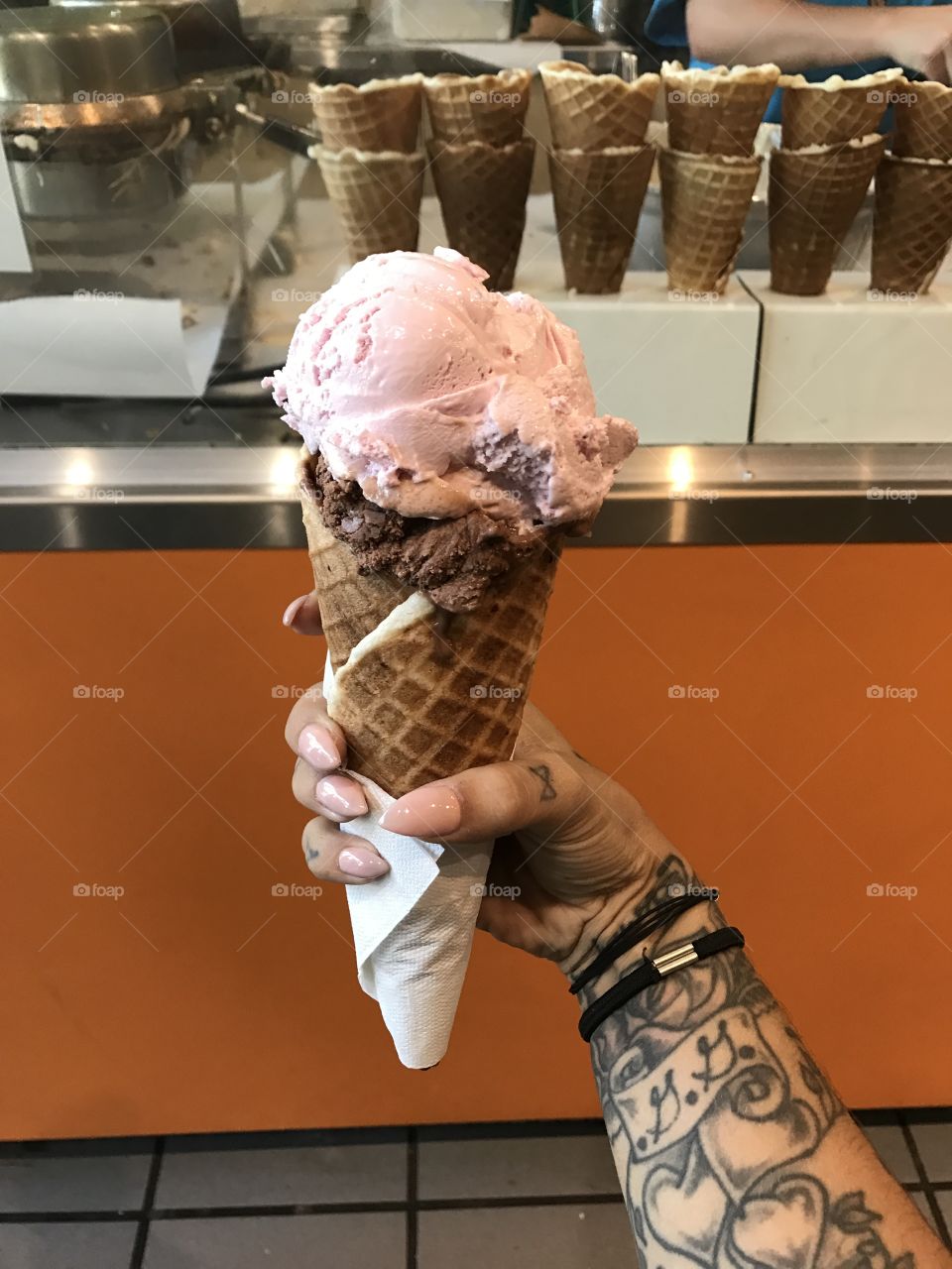 Giant helping of beautiful ice cream! Strawberry and chocolate in a waffle cone! 