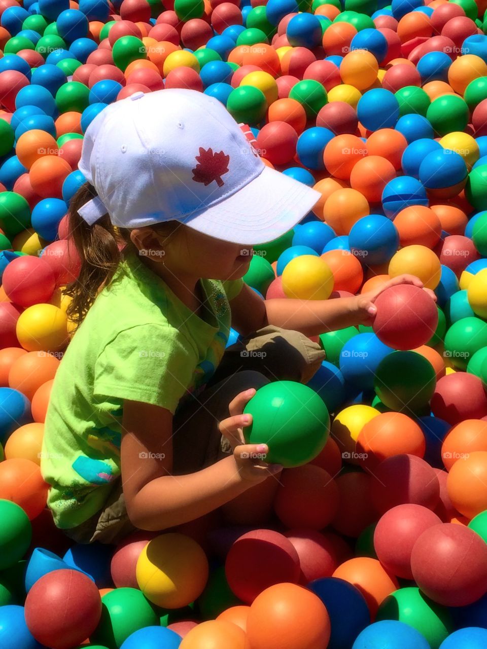 Girl in ballpit 