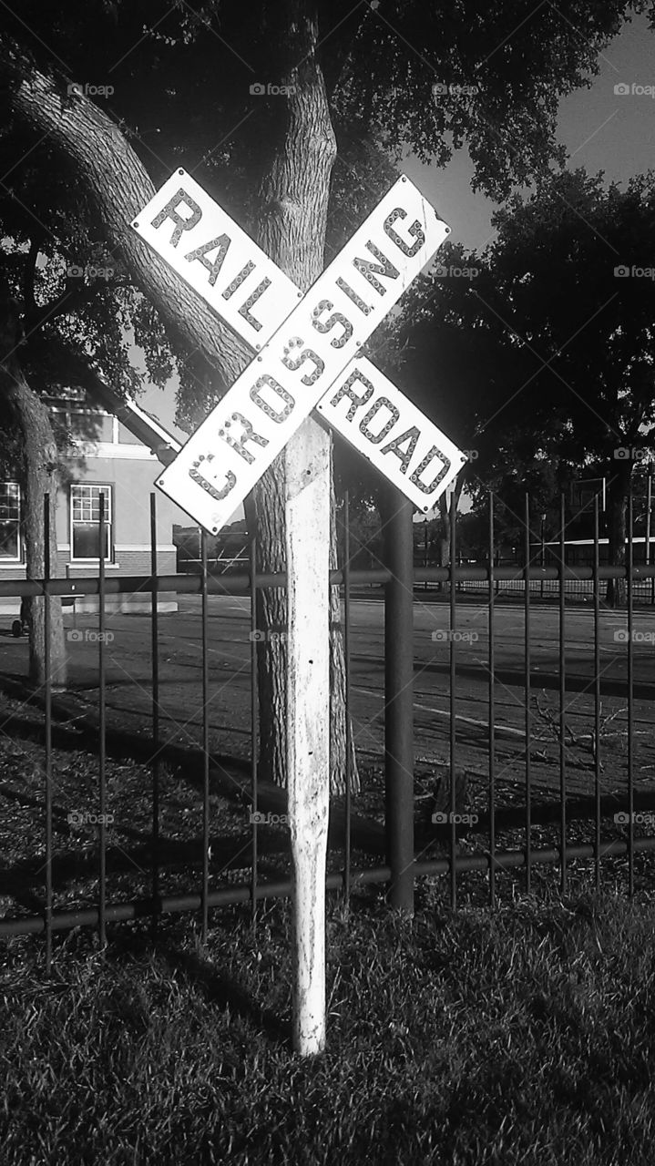 rail road cross ➕. This is a picture of a vintage railroad sign used to warn you of a train coming