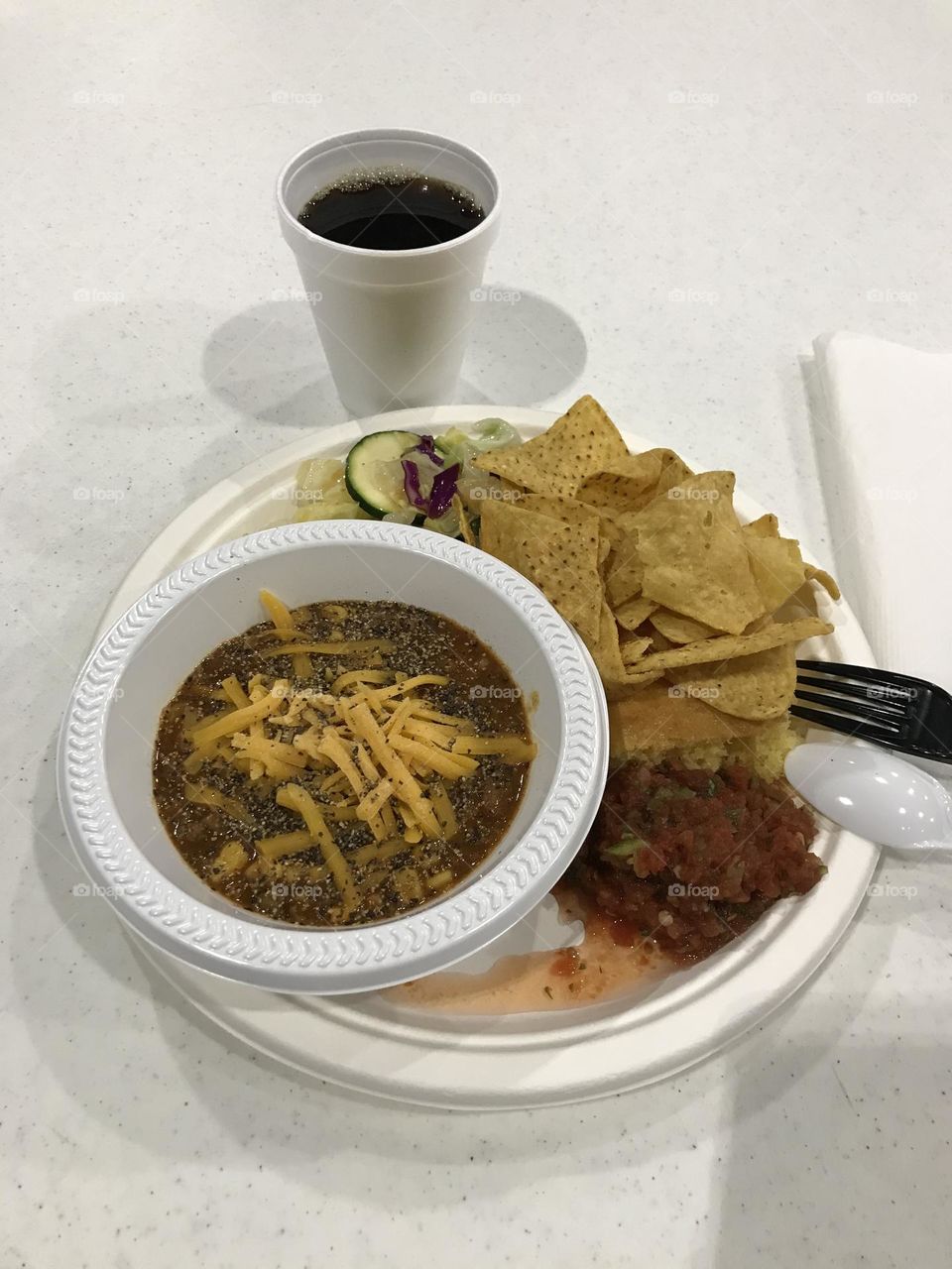 An evening meal with a cup of hot black coffee at church. The whole thing looks quite fulfilling.