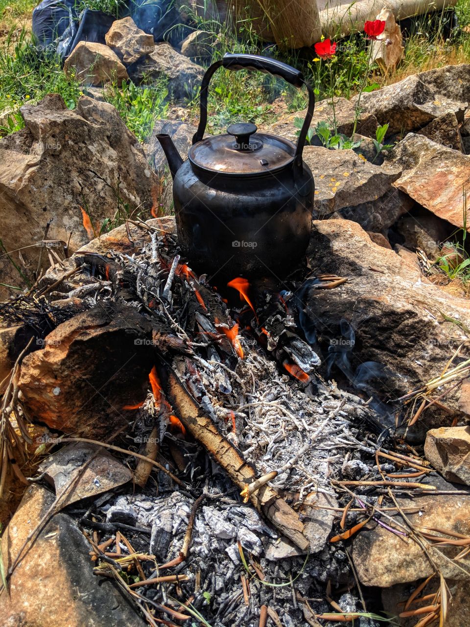 Outside afternoon teatime on a campfire