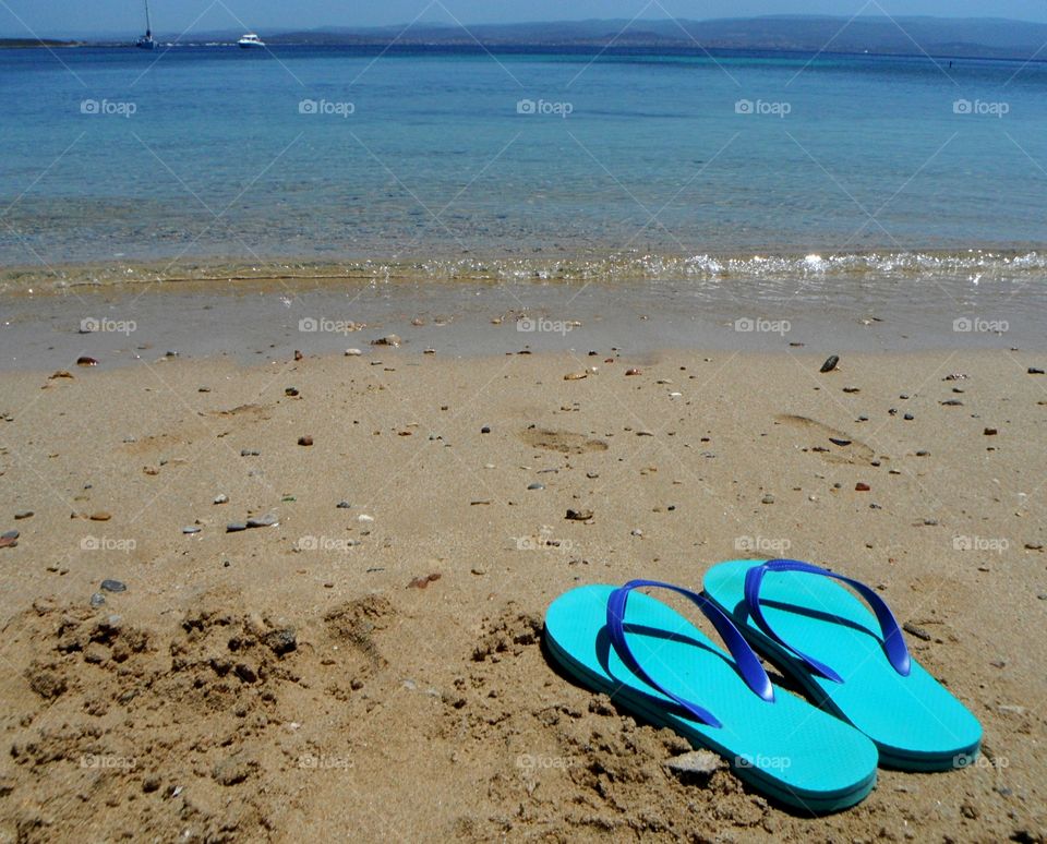 sandal in front of sea