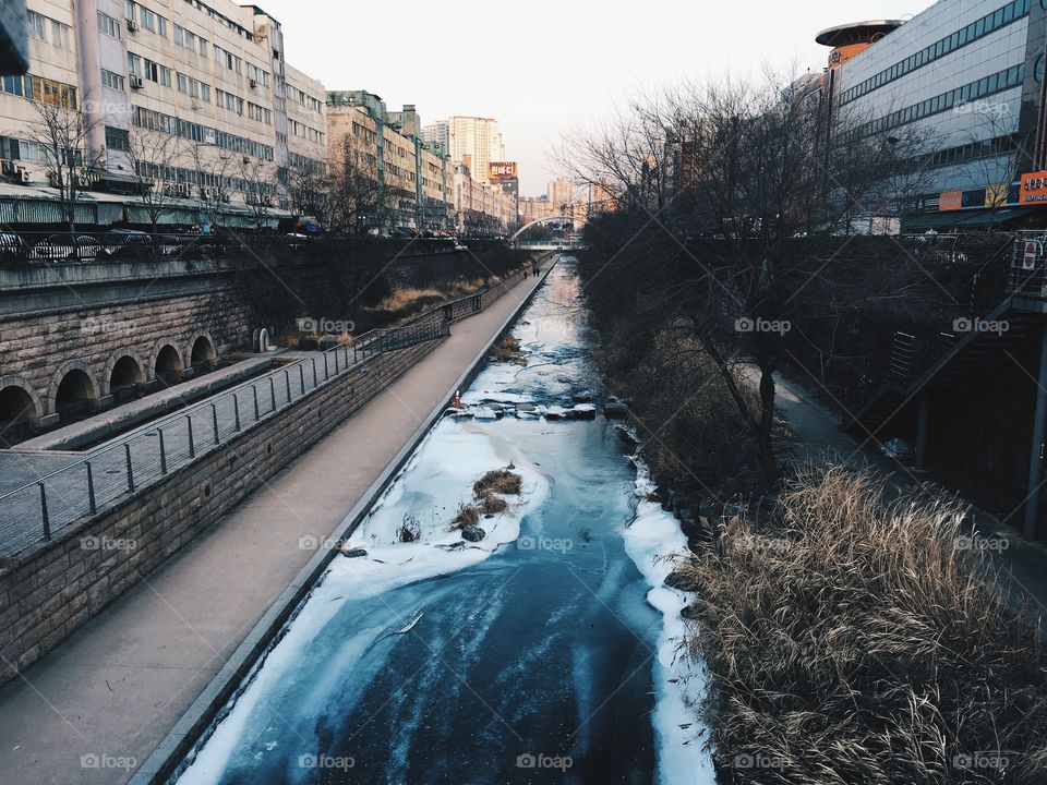 Small stream flowing in city