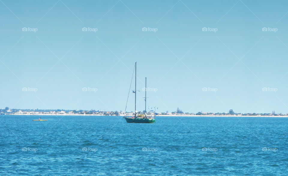 A boat and a white coast