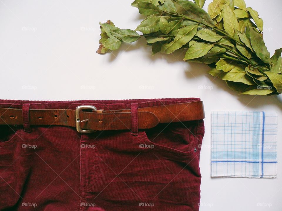 Velvet maroon pants and bouquet of laurel leaves