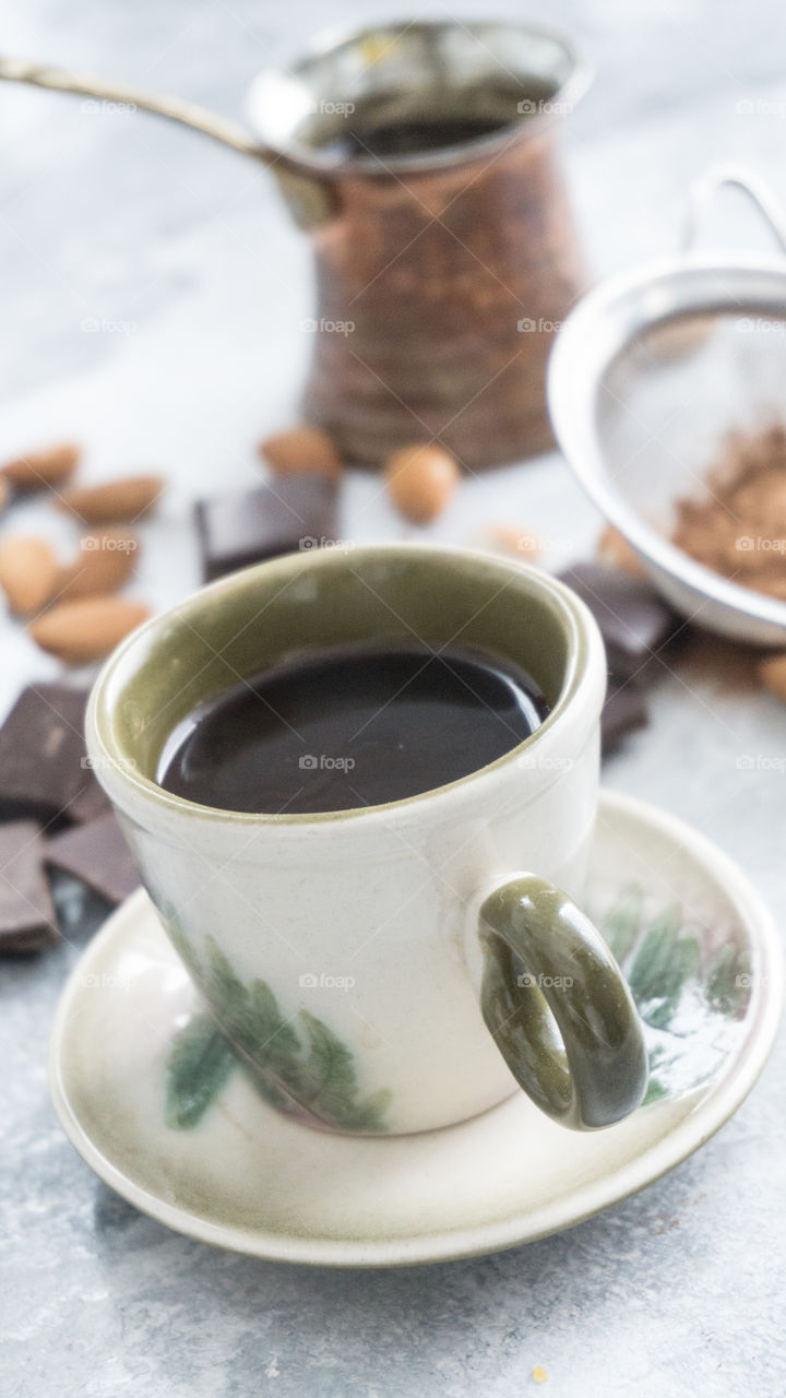 a cup of coffee with chocolate for dessert