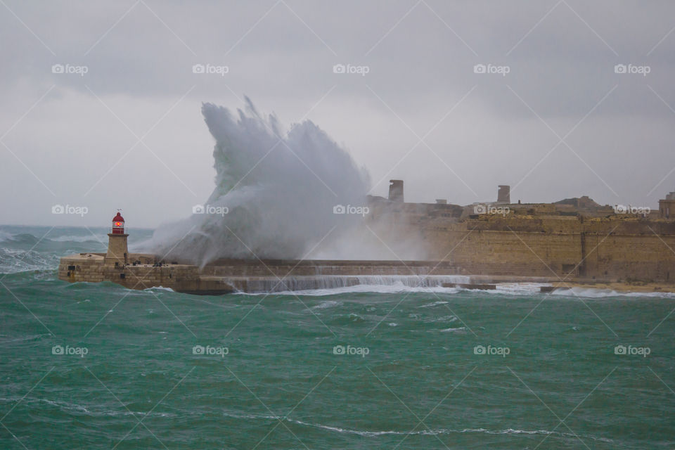 Storm hitting the Grand Harbour breskkwater in Valletta Malta