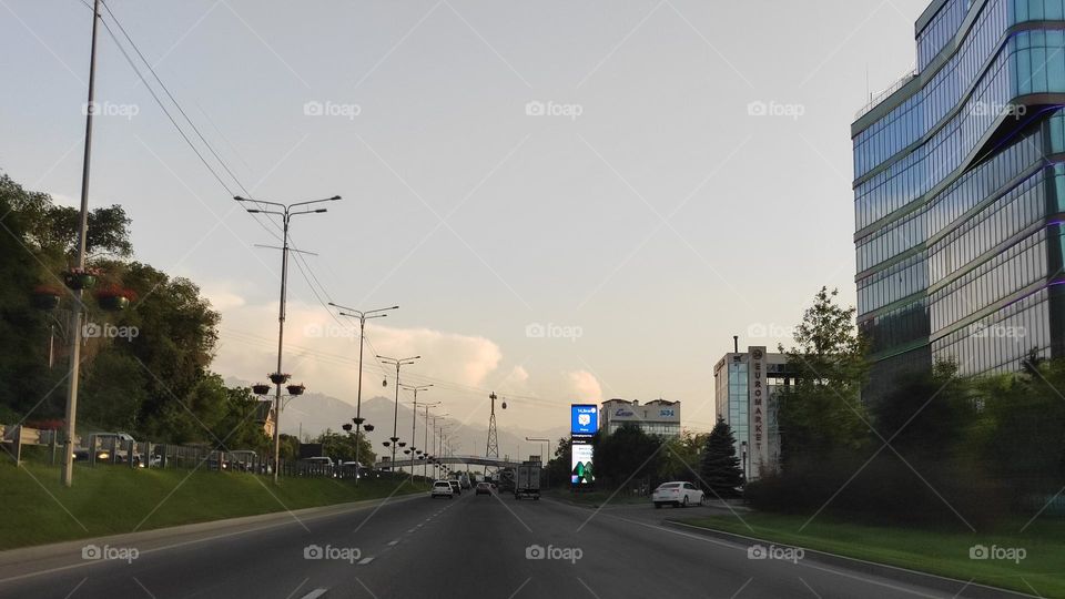 Highway. Clouds. Mountains. Bridge