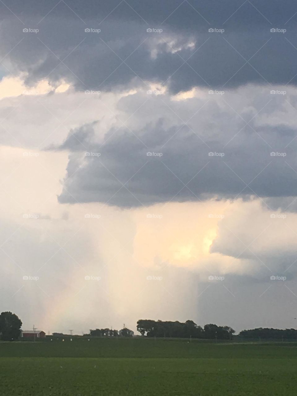 Crazy clouds with rainbow 