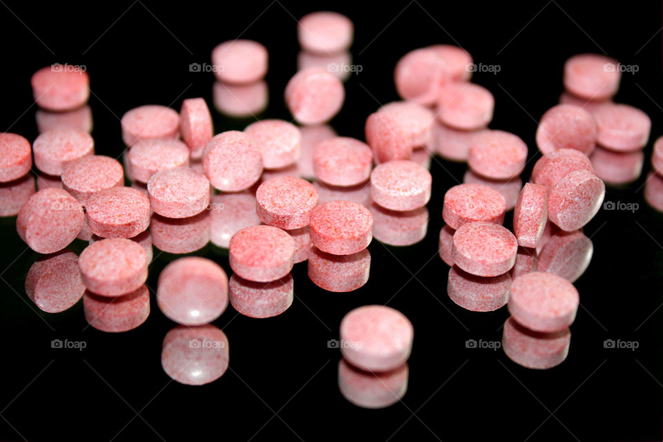 Pink pills, black background 2