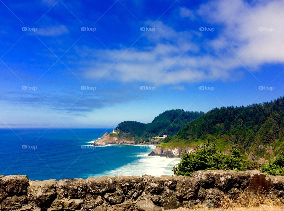 View of a oregon coast against cloudy sky