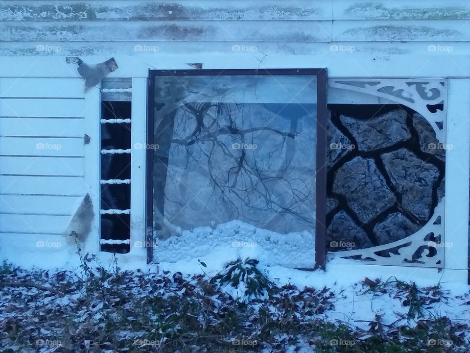 Snow covered old storm door
