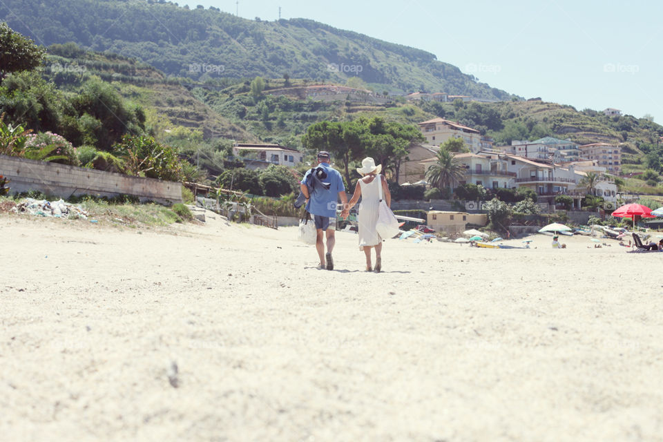loving old couple on italian beach