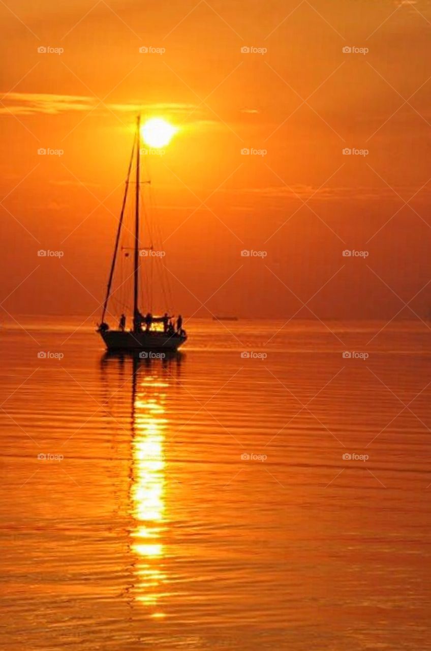 Sailboat in sunset 