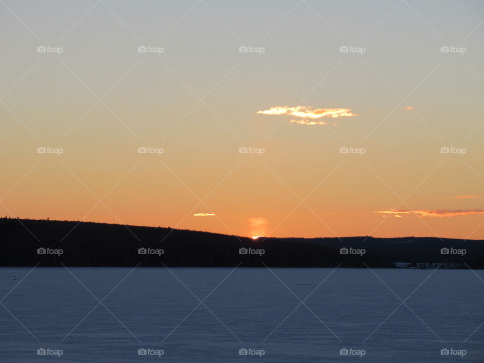 sunset in the Urals in Russia, March, another frost, snow,