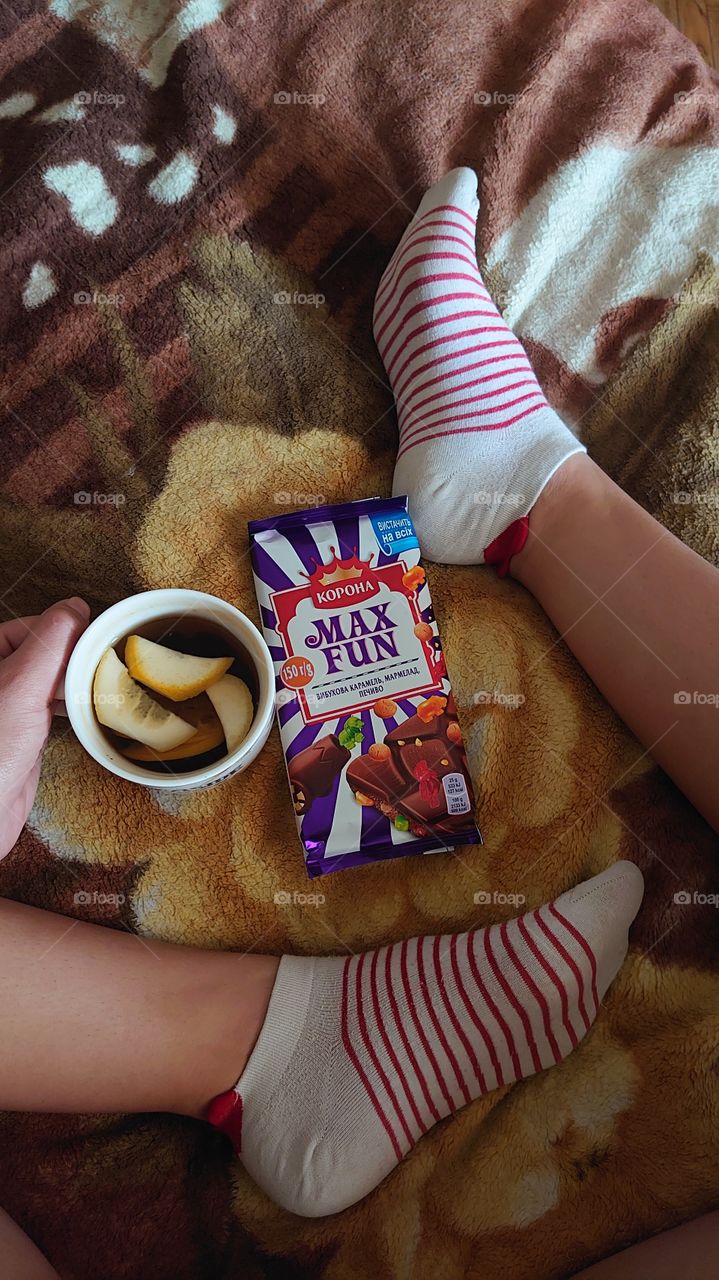 Cozy evening at home with tea and chocolate