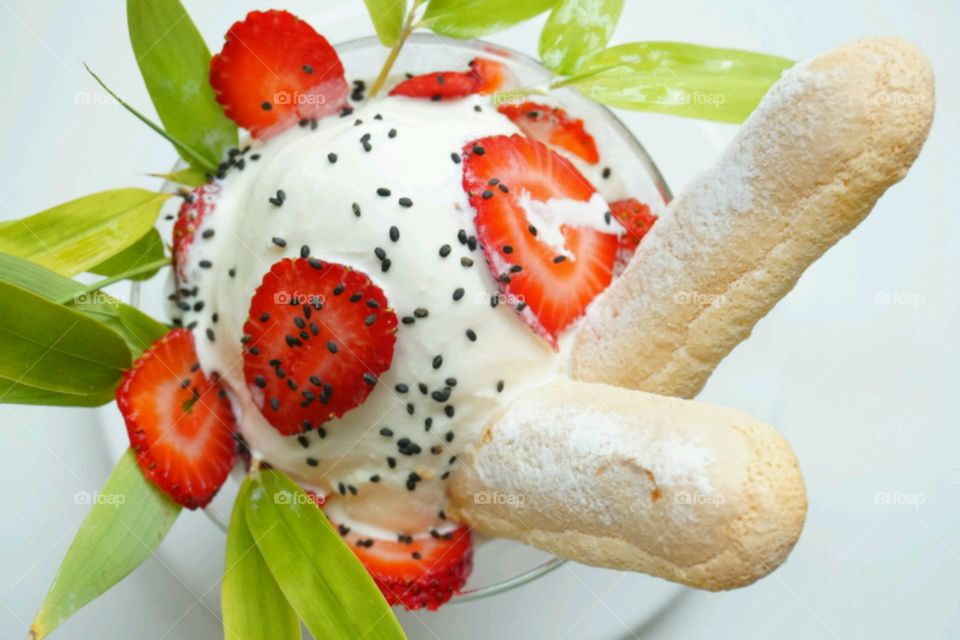 Elevated view of ice cream with strawberry