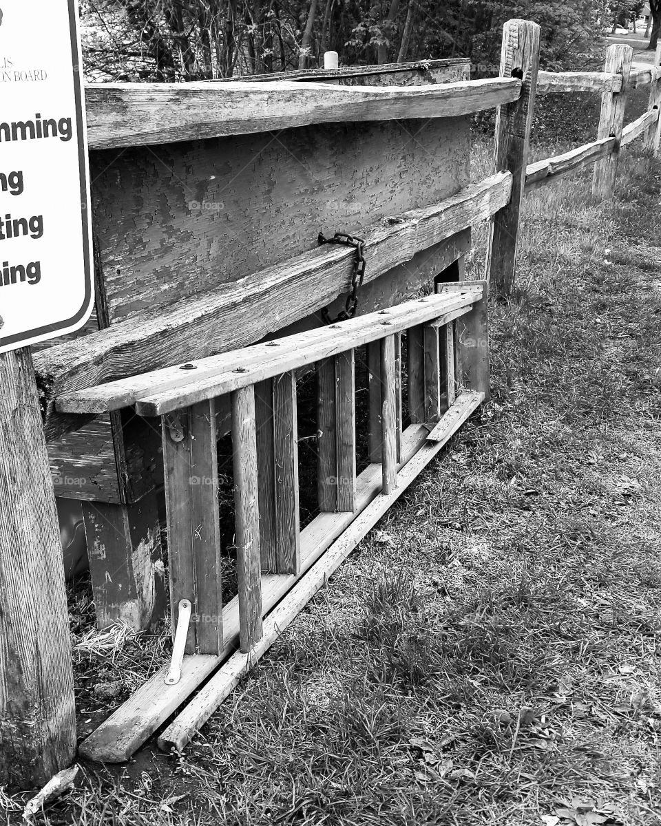 black and white abandoned ladder