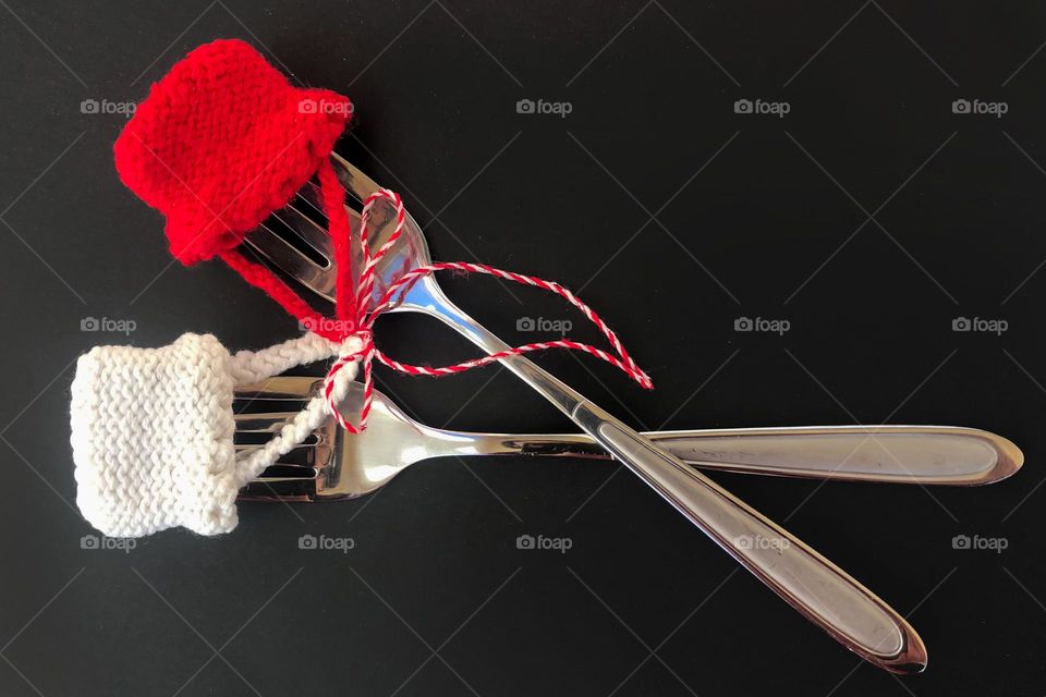 Forks Martenitsa. A Martenitsa is a piece of adornment, made of white and red yarn and usually in the form of two dolls, a white male and a red female. Every year on 1st of Martch, Bulgarian people exchange Martenitsa for health and good luck