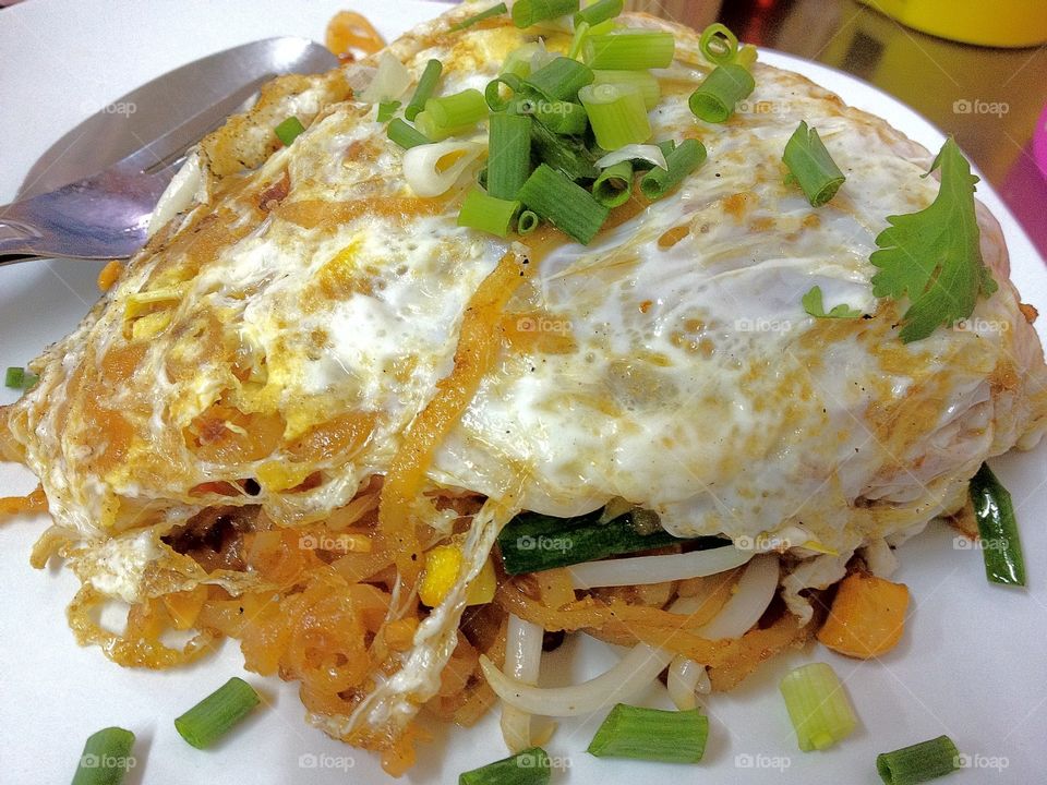 Pad thai wrapped in egg. 