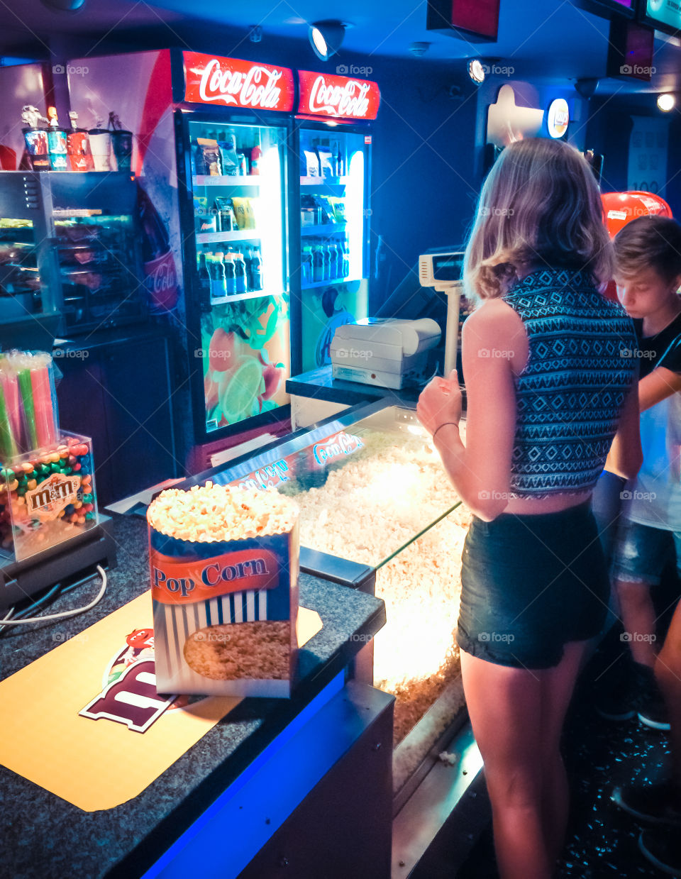 Customers Buying Pop Corn And Beverages At The Cinema
