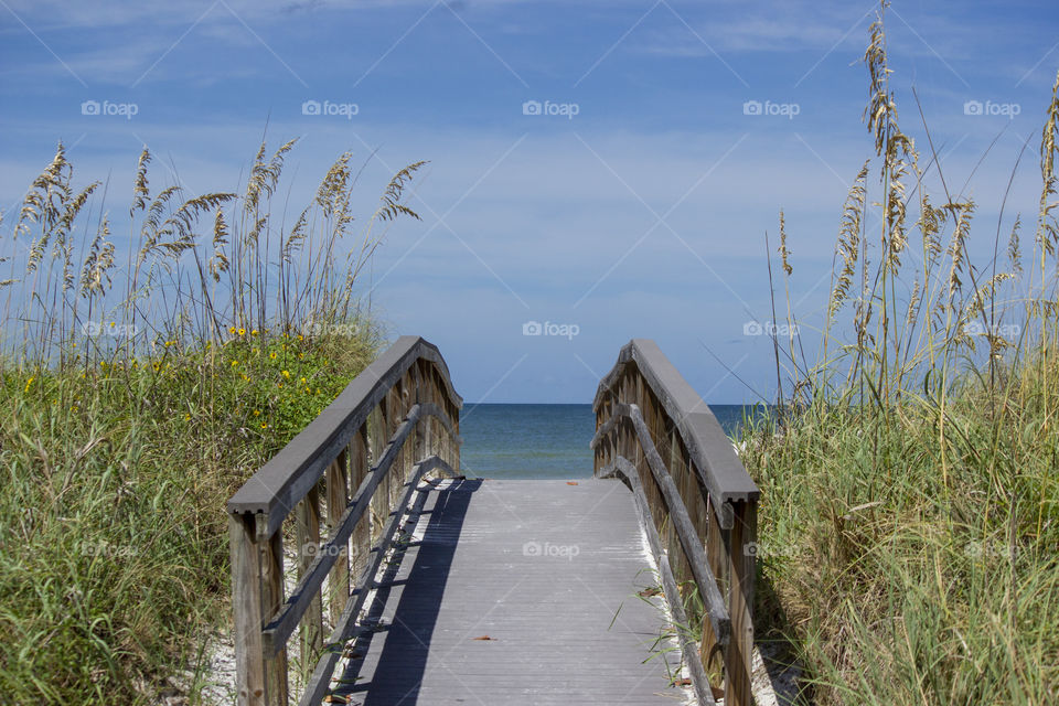 Bridge to Beach.  Beach, Destination, Healthy Lifestyle, Relaxing, Scenic, Tourism, Travel and Vacation Concepts.