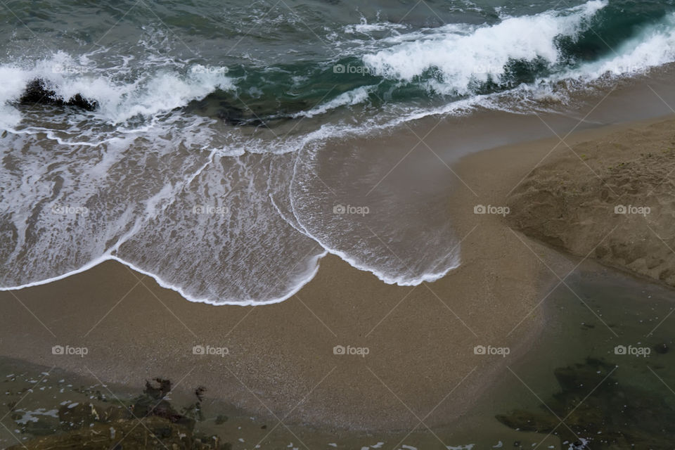 Waves on a sandy beach