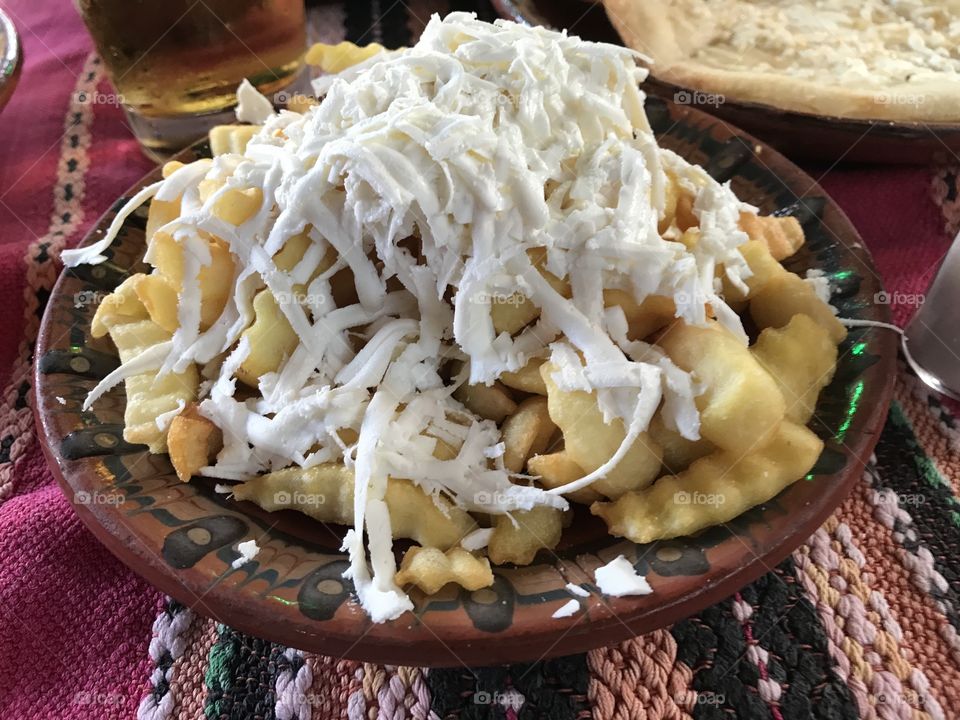 Yummy food in Bulgaria- feta cheese covered fried potatoes - tasty for sure 
