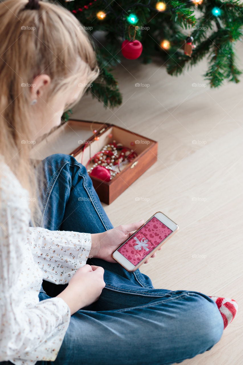 Teenage girl using smartphone