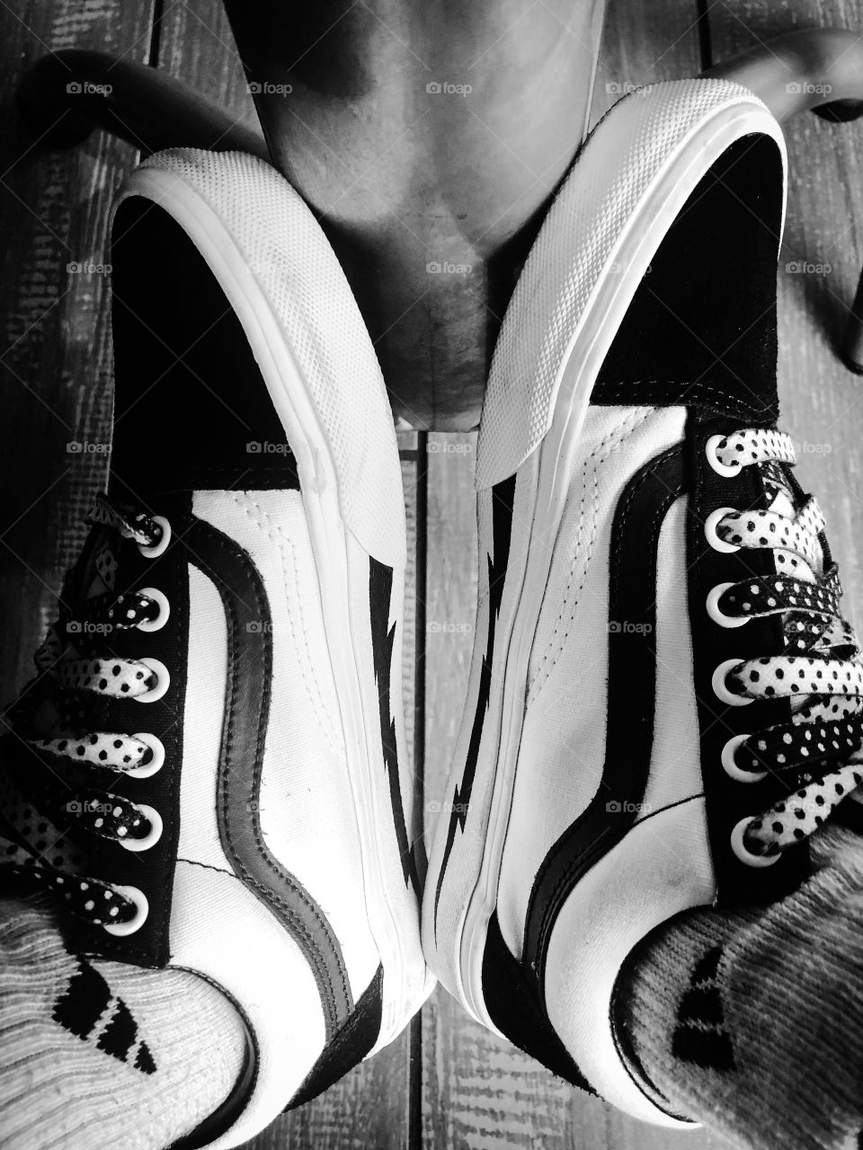 My customized old school vans shoes. Black and white only with lightning bolt foxing, double sided polka dot laces, and black suede vamp and heel counter.