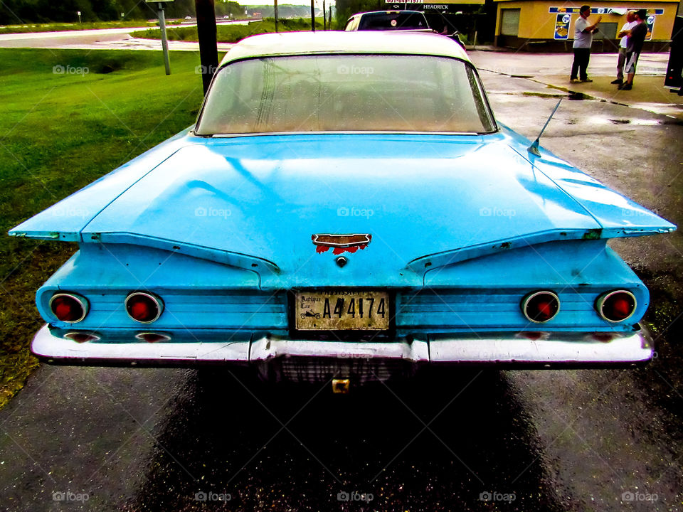 back view of blue vintage car