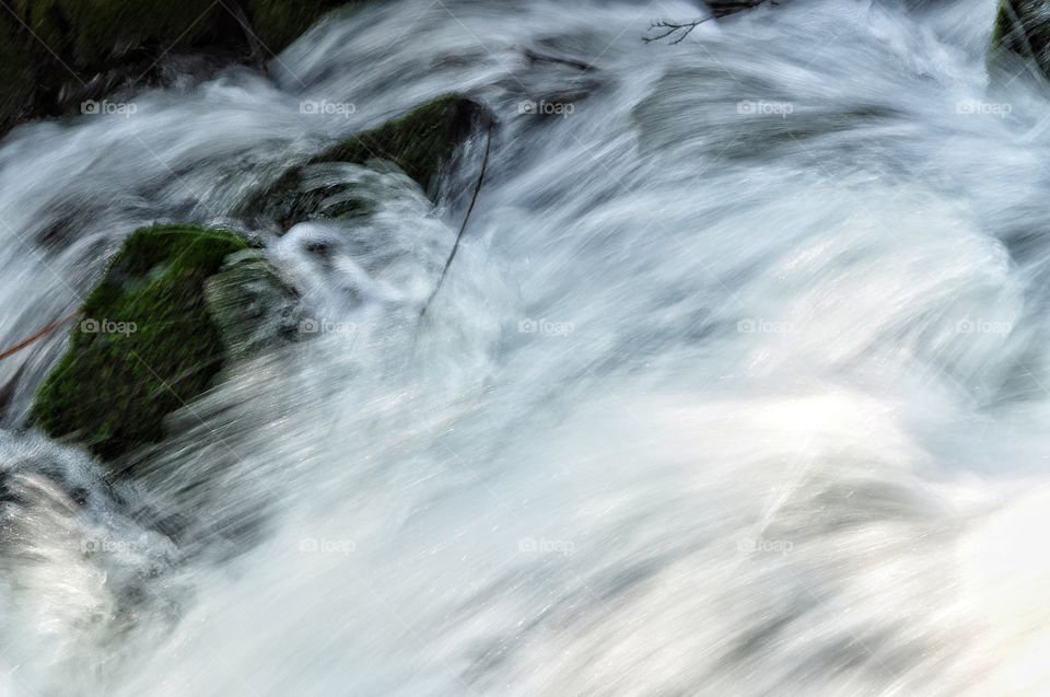 waterfall and river in park in Poland