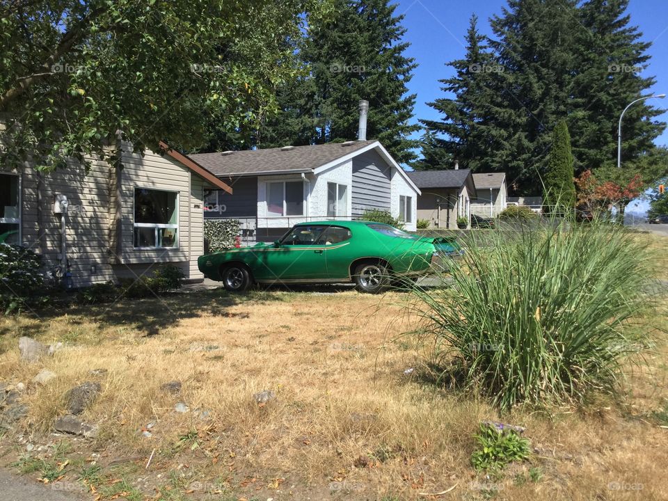 Old Classic Muscle Car at a Home