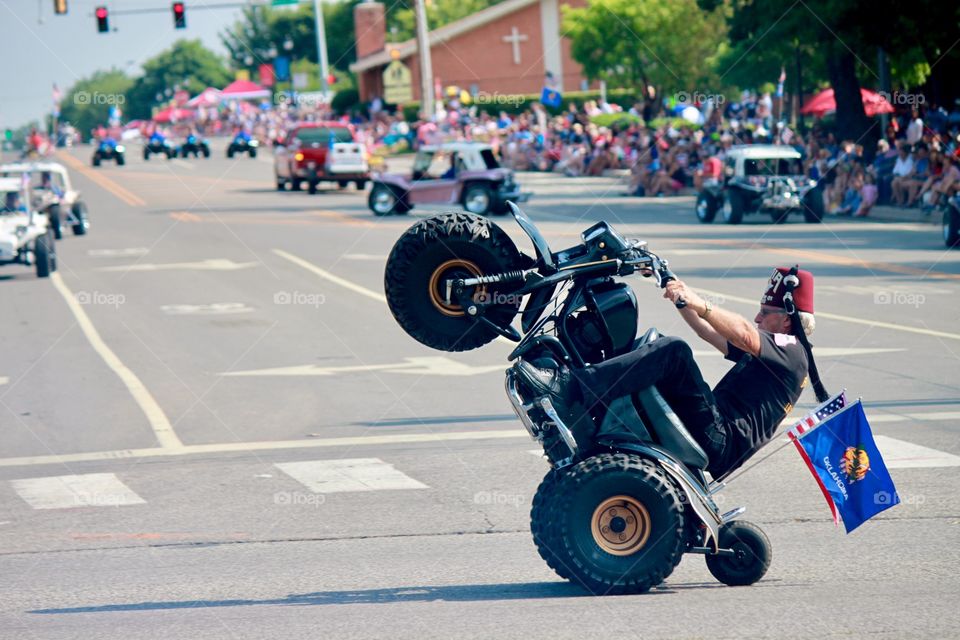 Clown Doing Wheelie with American and Oklahoma Flag