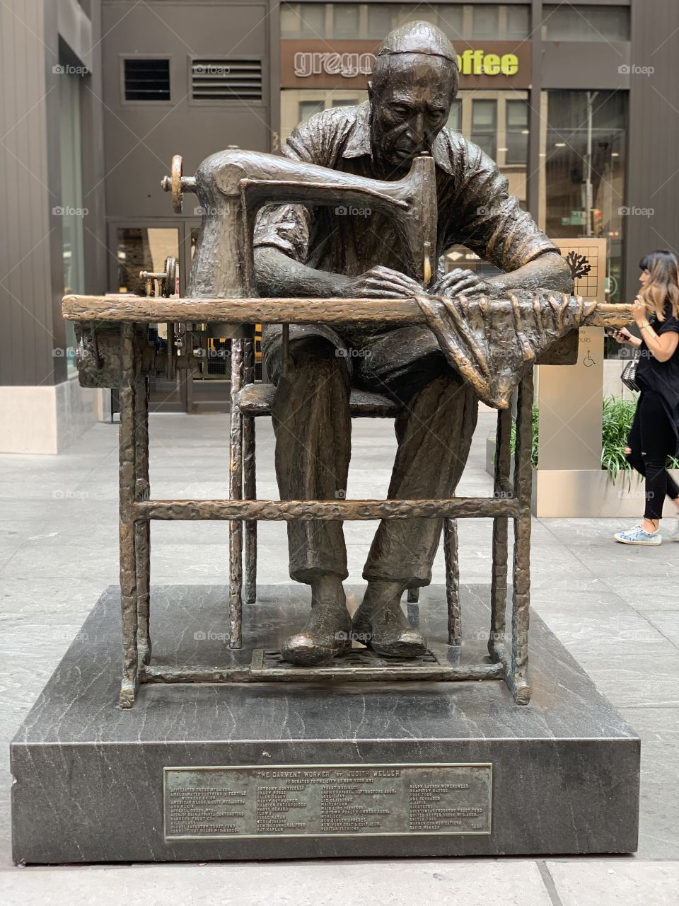 Statue of man sewing in NYC fashions district 