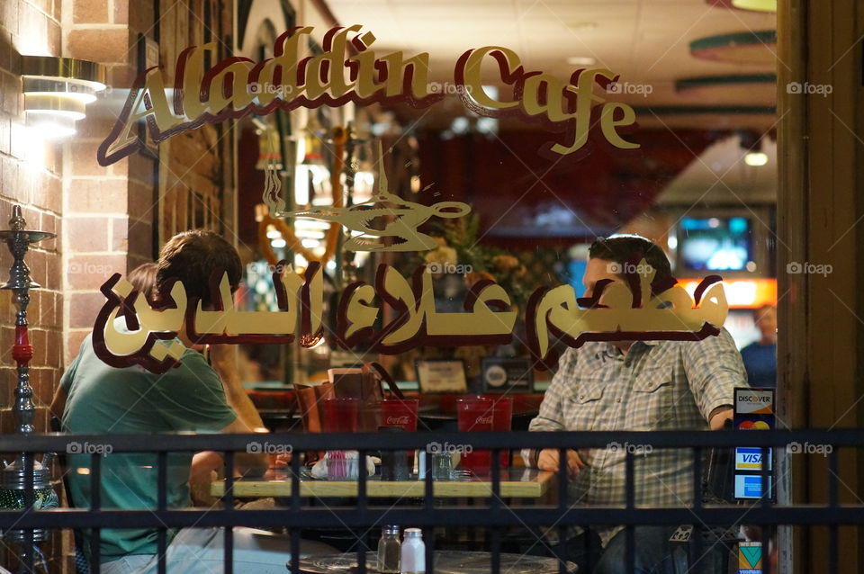 Aladins cafe. Patrons at a Mediterranean cafe