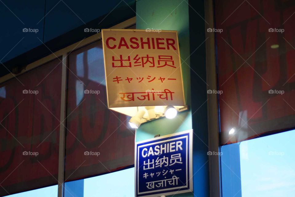 Cashier sign in different languages