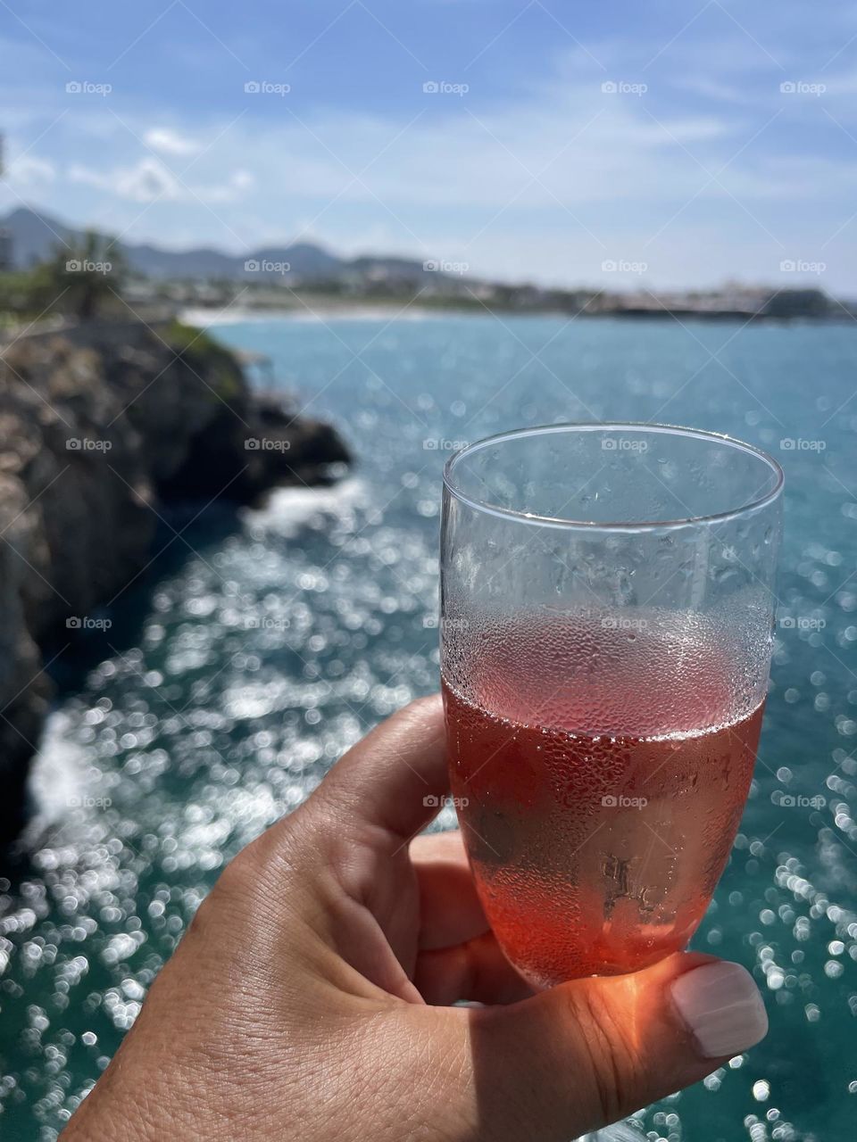 A cocktail with an ocean view 