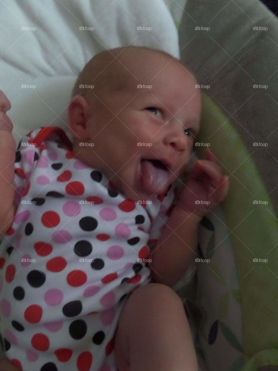 Silly baby with tongue sticking out