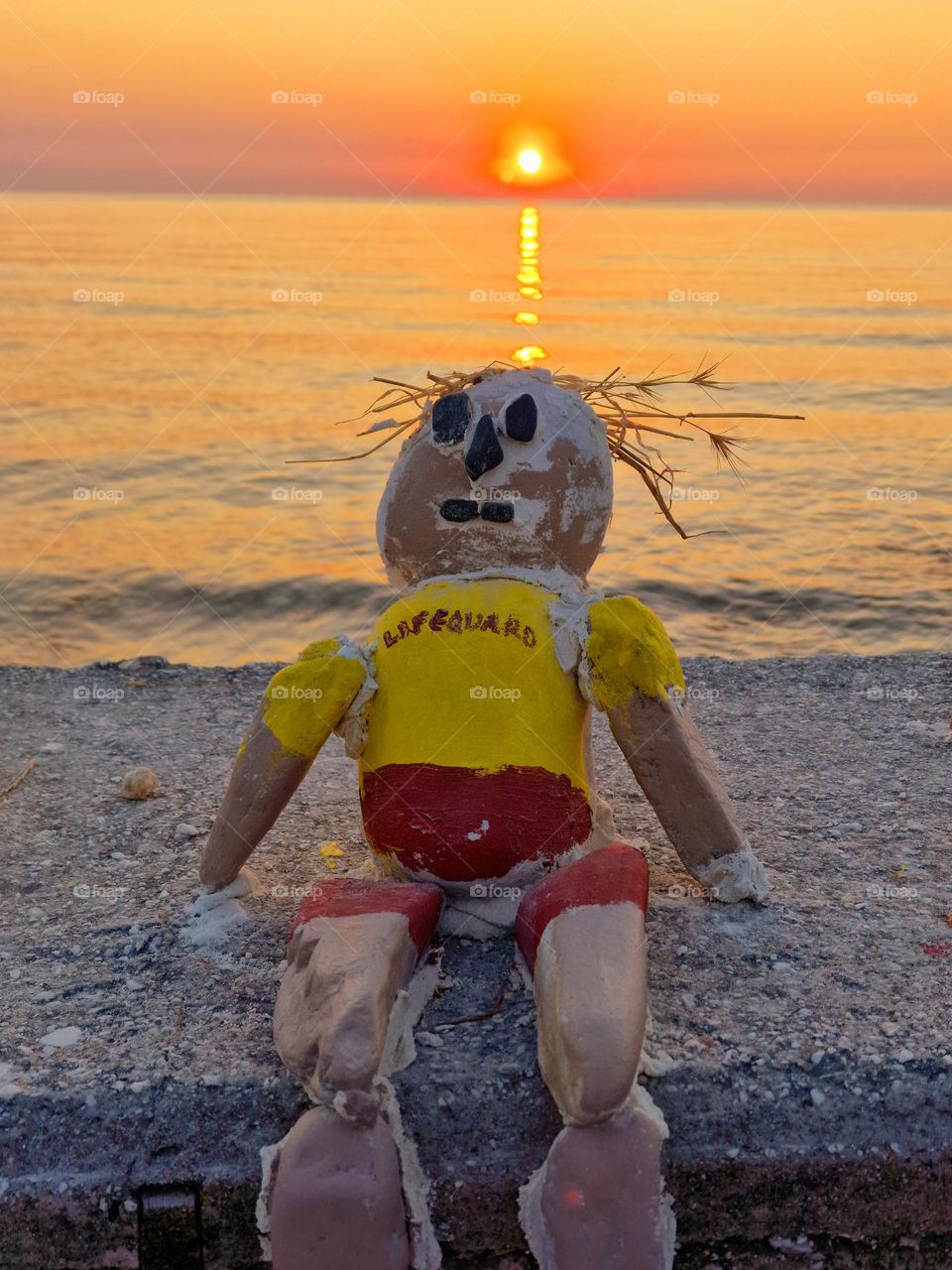 lifeguard doll made of stones